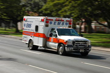 A speeding ambulance, with motion blur