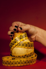 pear with measuring tape