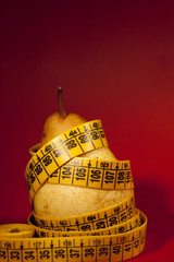 pear with measuring tape