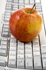 red  apple on keyboard