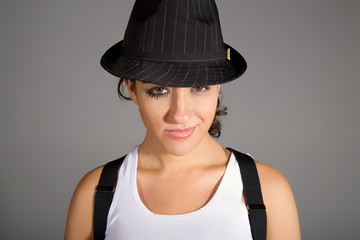 young .woman with great makeup on wearing hat