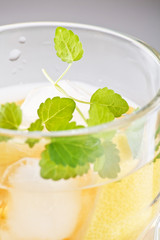 Cocktail with lemon and mint.