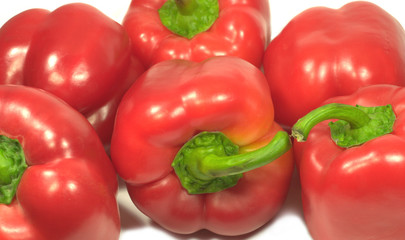 Red sweet fresh peppers isolatede on white