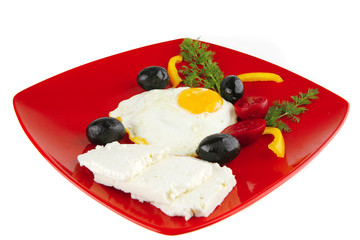fried egg served on red dish