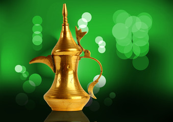 Dallah - the Traditional arabic coffee pot in green light backgr