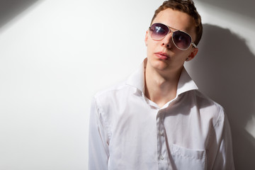 portrait of young handsome man in sunglasses