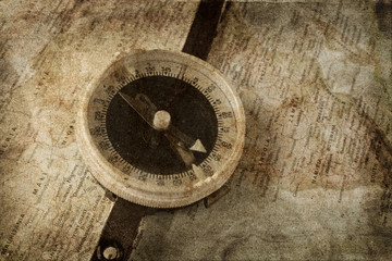 Fototapeta na wymiar Old compass on map grunge background