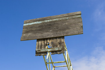Board on a blue sky background