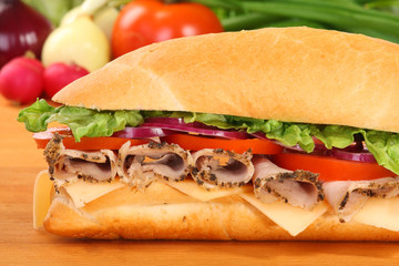 A large ham and tomato sandwich