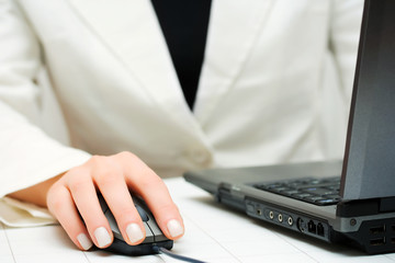 Female hands working on laptop.