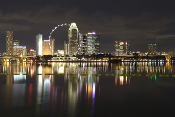 View of Singapore Flyer with buildings and bridges by Marina Bay