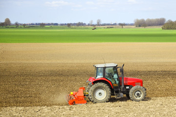 a tractor cultivating