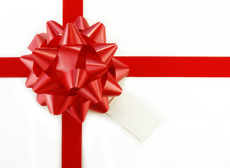 Red Gift Bow and Tag on White Box
