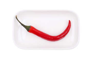 Red hot chili pepper on white dish