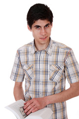 Handsome young man reading a book