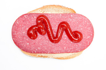 Top view of sandwich with salami and ketchup isolated on white background