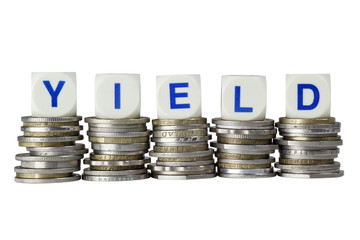 Stacks of coins with the word YIELD isolated on white background