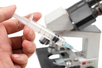 Naklejka premium syringe and microscope