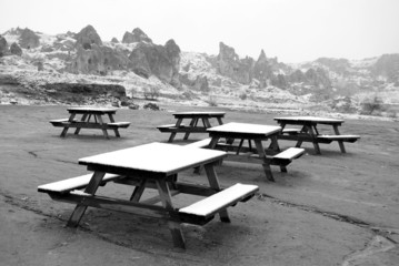 Fototapeta na wymiar Empty park benches in winter