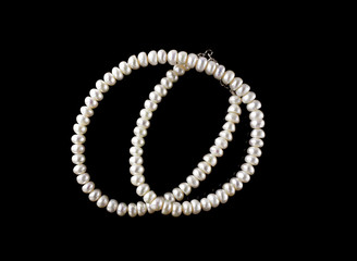 pearl necklace isolated on the black background