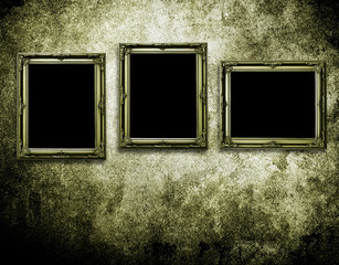 picture frames on grunge wall