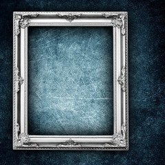 silver frame on grunge wall