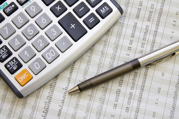 Balancing the Accounts. Calculator, pen