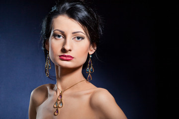 Portrait of elegant beautiful woman wearing jewelry.