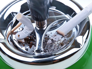 burning cigarette on ashtray