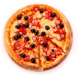 Pizza with olives on wooden plate isolated on white.