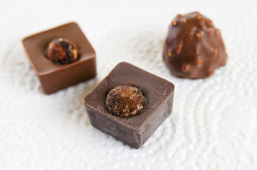 Several chocolate candies on white