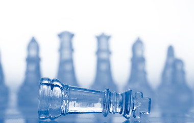 glass chess pieces with blue light