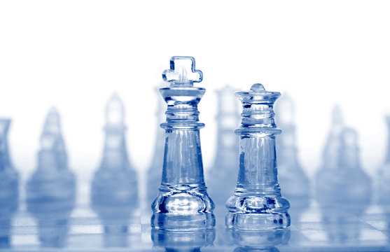 glass chess pieces with blue light