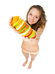 Obraz premium Portrait of happy young woman holding mixed fruits