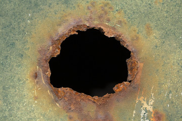 rusted hole