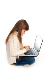 The sitting little girl with the laptop