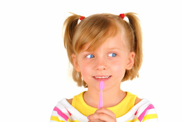 Cute little girl is brushing teeth