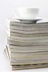 Magazines and coffee cup