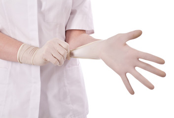 pulling on surgical glove