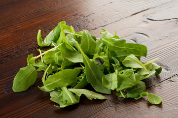 Fototapeta premium arugula on ancient wood table