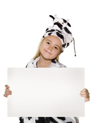 Little girl dressed in cow costume over white.