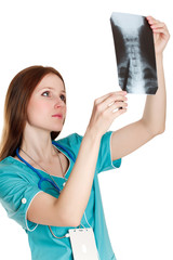 Female doctor looking at the x-ray image