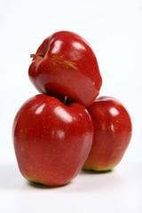 Three red apples on white background