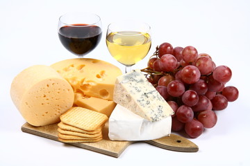 Various types of cheese, wine,grapes,crackers