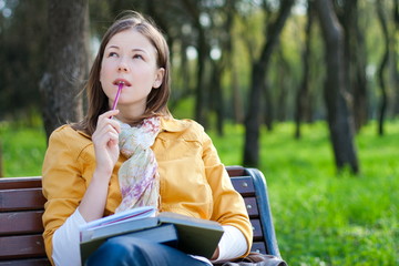 woman with book in park