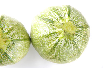 green courgettes on white