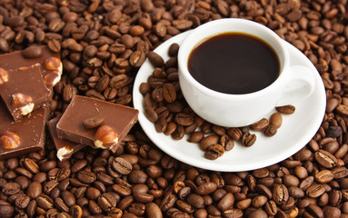 cup of coffee on a background coffee grains