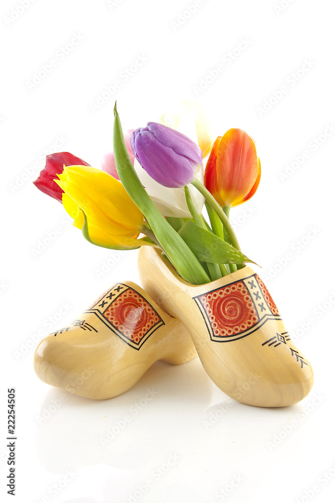 Wall mural Pair of traditional Dutch wooden shoes with tulips