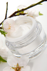 Face cream and almond flowers