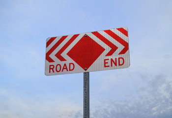 Road End Sign with sky in background